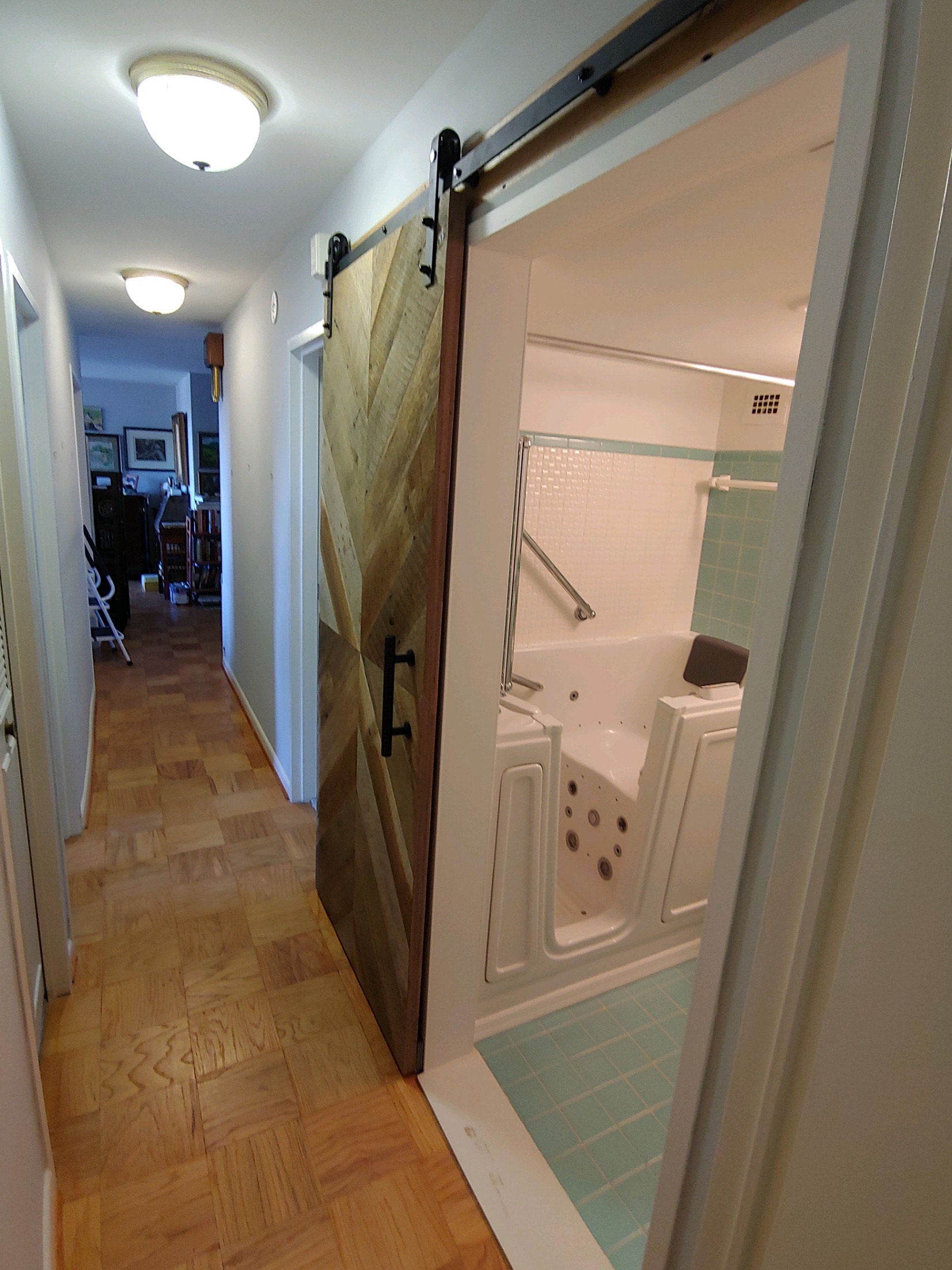 Image of sliding barn door in master bathroom
